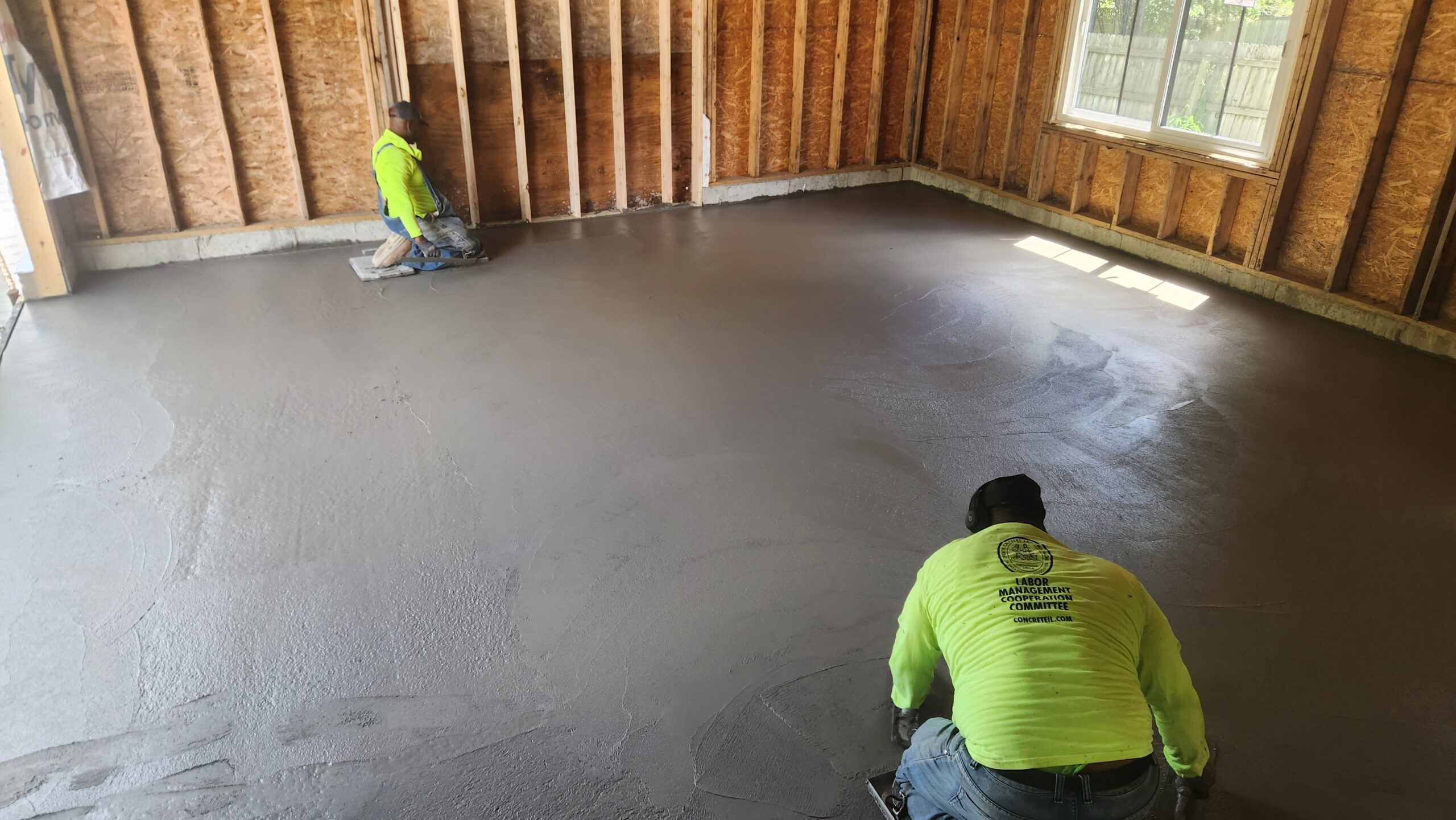 Pegasus crew finishing a freshly poured concrete floor