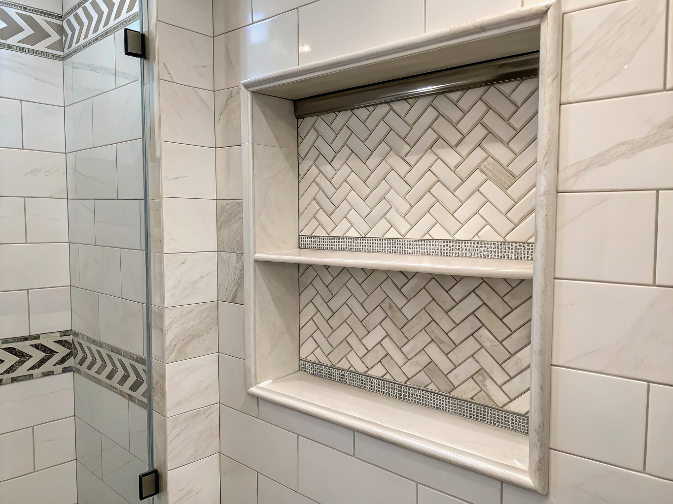 Custom herringbone tile niche in Chicago walk-in shower installation
