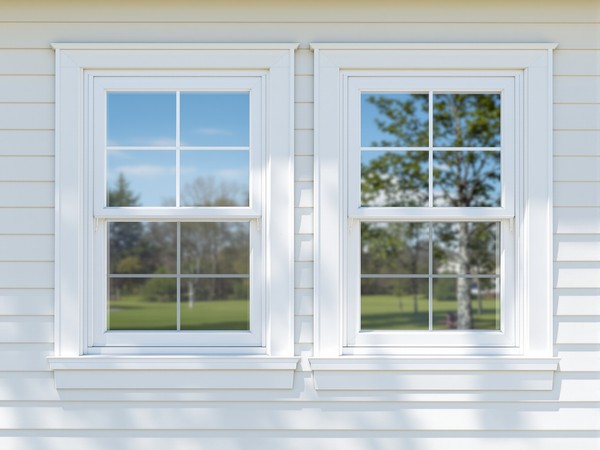 Crisp white double-hung windows on a Chicago home